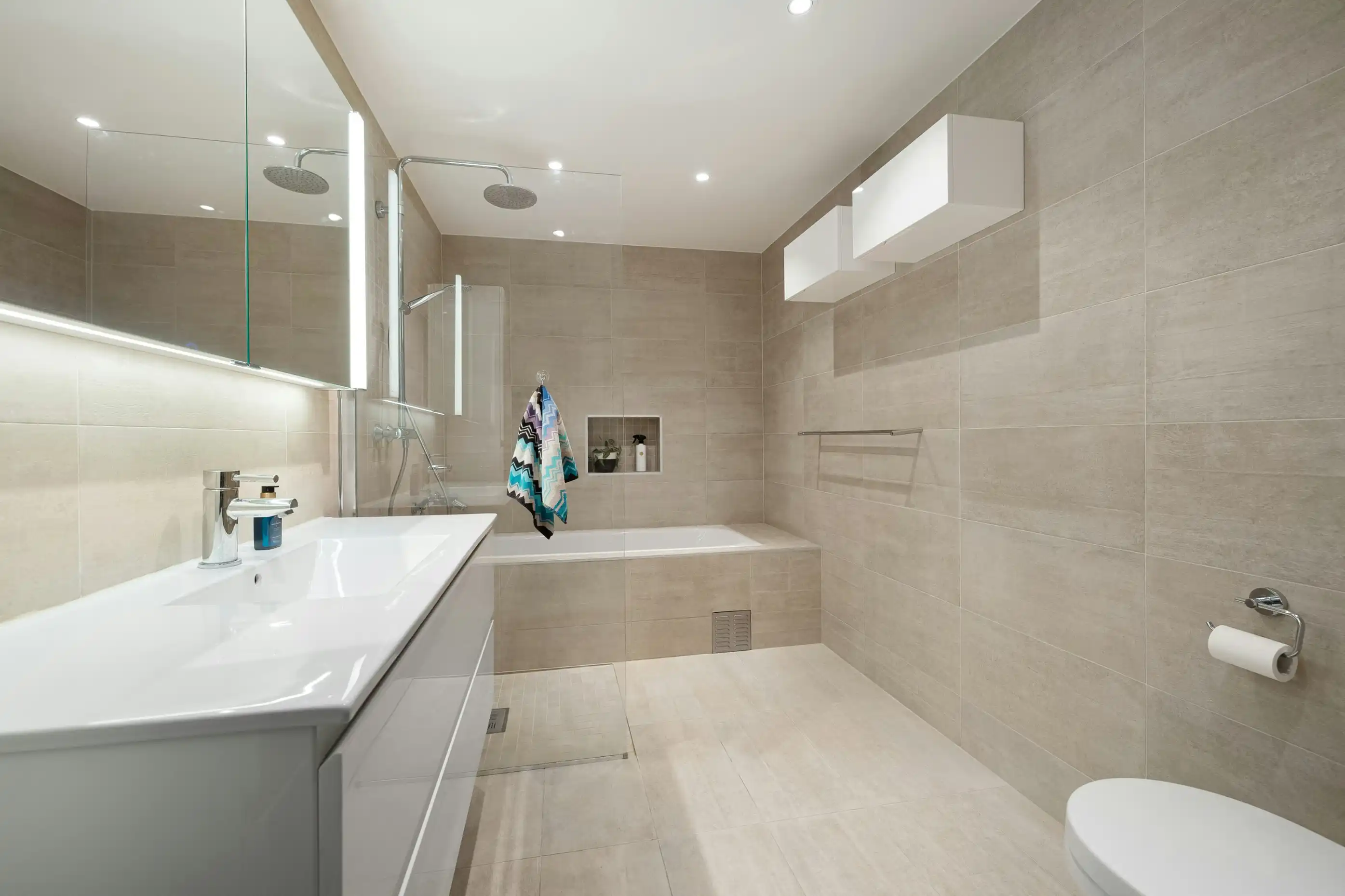 Small tiles, busy bathroom design, comparison